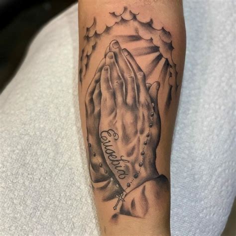 praying hands tattoo